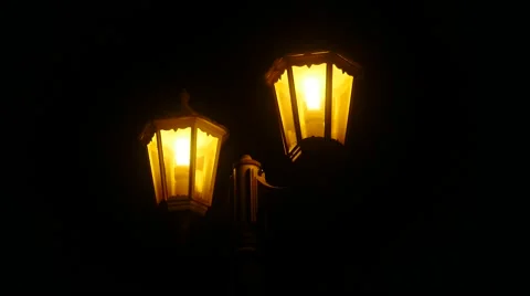 Closeup on yellow glowing lanterns outside a house yard Stock Footage 67395029