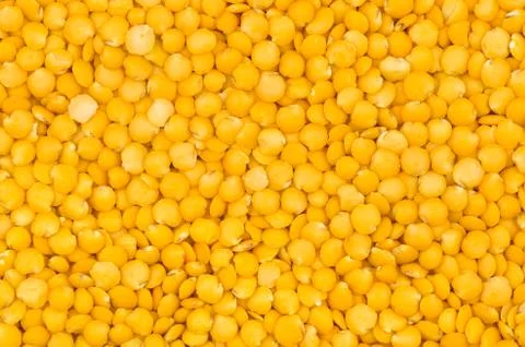 Closeup yellow lentils texture Stock Photos