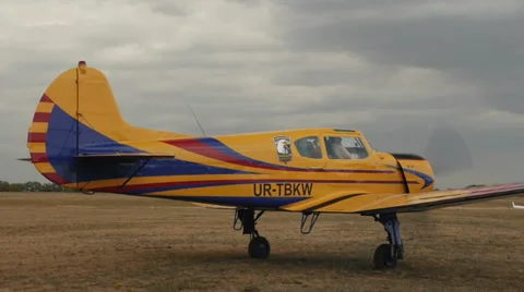 Closeup of yellow plane Yakovlev Yak-18T awaits clearance to take off with the Stock Footage 38394585