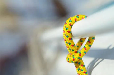Closeup of yellow thin short rope used for any purposes on the boat Foto stock