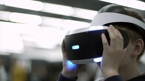 Closeup of Young boy with a small hands holding virtual reality glasses Stock Footage 84332145