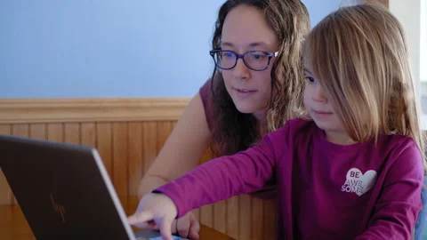 Closeup of Young Child with Mom on Computer at Home Stock Footage 150277388