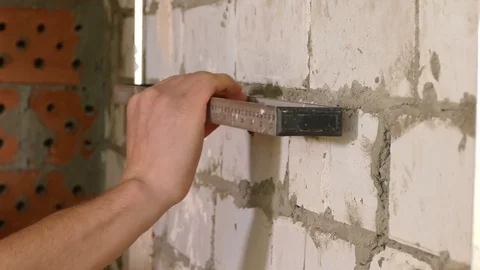 Closeup of Young constructor working With Level Stock Footage 71940063