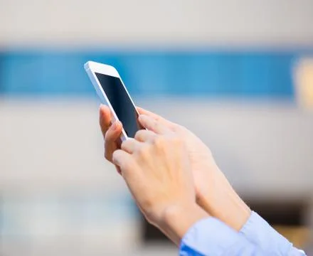 Closeup young female hands using, holding smart phone Stock Photos