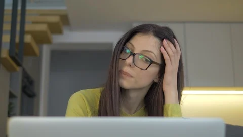 Closeup Of A Young Lady Working From Home And Getting Bored Video stock 128366246