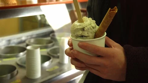 Closeup of a young man with an artisan mint ice cream with his hands in Huaras Stock Footage 164468557
