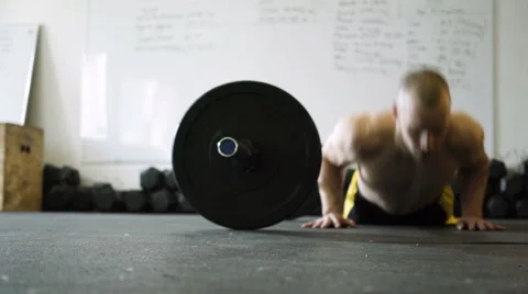 Closeup of young man doing burpee over the bar exercise Stock Footage 65279758