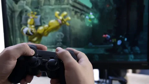 Closeup of young man hands playing video games on gaming console in front Stock Footage 129661025