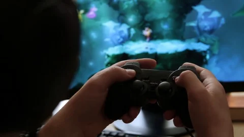 Closeup of young man hands playing video games on gaming console in front Stock Footage 129661065