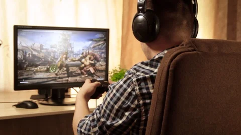 Closeup of young man hands playing video games on gaming console in front 스톡 동영상 129666236