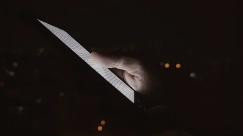 Closeup of young man hands scrolling pictures on phone screen Stock Footage 83426317