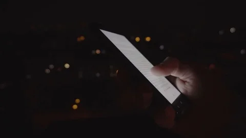 Closeup of young man hands scrolling pictures on phone screen Stock Footage 83576762