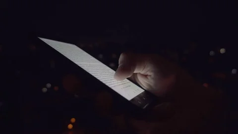 Closeup of young man hands scrolling pictures on phone screen Video stock 84021196