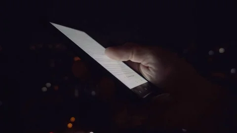 Closeup of young man hands scrolling pictures on phone screen Stock Footage 84253836