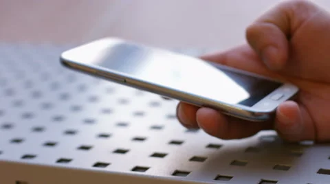 Closeup of young man hands typing sms scrolling pictures phone Stock Footage 50180520