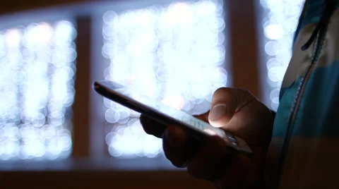 Closeup of young man hands typing sms scrolling pictures phone. 4K 30fps Video stock 54998921