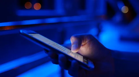 Closeup of young man hands typing sms scrolling pictures phone. 4K 30fps Video stock 55010870