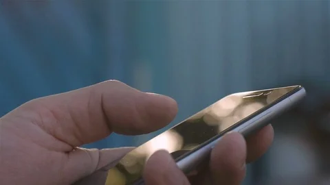 Closeup of young man hands typing sms scrolling pictures phone Stock Footage 75164203