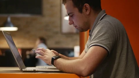 Closeup of young man hands typing sms scrolling pictures phone. 4K. Stock fotage Stock Footage 79864253