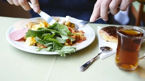 Closeup on a young man having breakfast Stock Footage 73071255