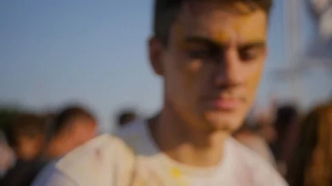 Closeup of young man having fun on the Holi Festival Stock Footage 91830467