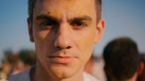 Closeup of young man having fun on the Holi Festival Stock Footage 91833640