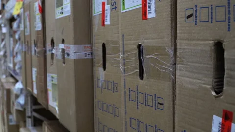 Closeup young man looking for box at store warehouse shelf 4k Stock Footage 88683740