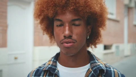 Closeup, young man posing looking at the camera on the street Stock Footage 254915168