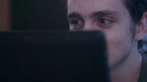 Closeup of young man reading happily on a tablet Stock Footage 75278518