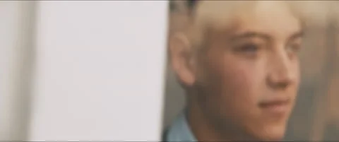 Closeup of a young man staring outside through the window Stock Footage 203586318