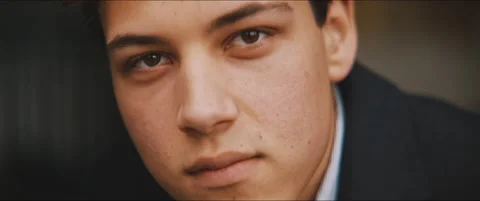 Closeup of a young man staring serious at the camera Stock Footage 203585568