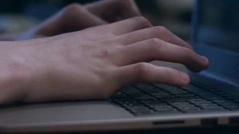 Closeup of young man typing on laptop keyboard Stock Footage 75278534