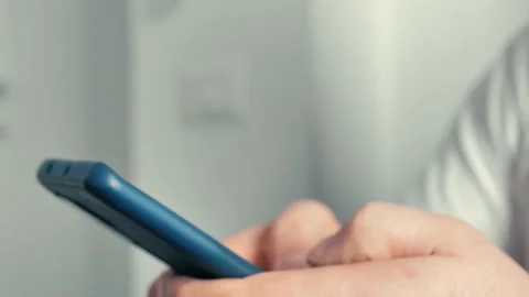 Closeup young man use smartphone working from side view Stock Footage 170237721