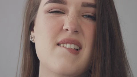 Closeup of young model having fun and making faces, quaver, play the ape to a Stock Footage 88246814