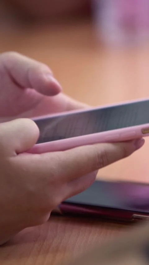  Closeup young students reading a text on smart phone. Education concept. Stock Footage 318743005