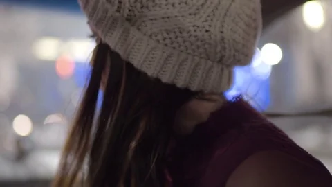 Closeup Of Young Woman Looking Over Shoulder At Backseat, Sings To Them Stock Footage