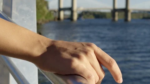 Closeup Of Young Woman's Hand Resting On Railing Of River Dock In City Stock Footage 95927545