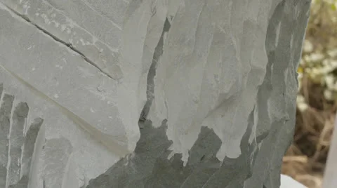 Closeups of hands chiseling rock statues in Cambodia Stock Footage 24927642