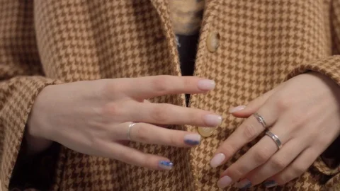 Closeupshowing classic jacket in goose paws warm brown print Stock Footage 124903117