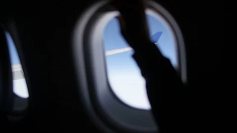 Closing And Opening Airplane Window Shades With View Of Plane Wing Video stock 75969390