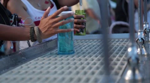 Closing blue bottle with right hand Stock Footage 51891374