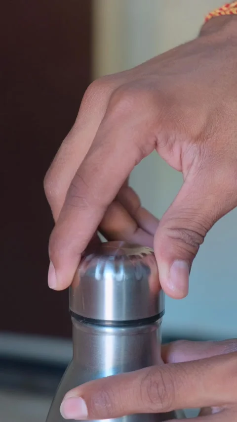 Closing Bottle Cap by Hand Close Up Stock Footage 332654148