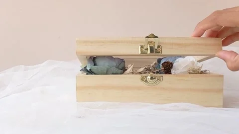 Closing a box of memories on a fluffy table Stock Footage 145623097