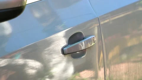 Closing the car door with key Stock Footage 110731058