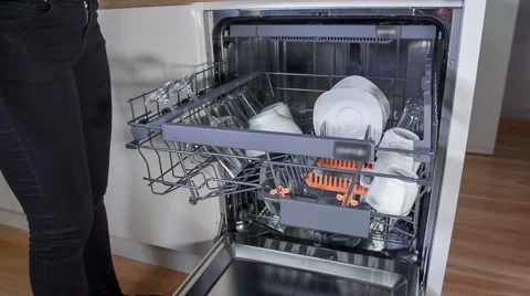Closing the dishwasher Stock Footage 65018527
