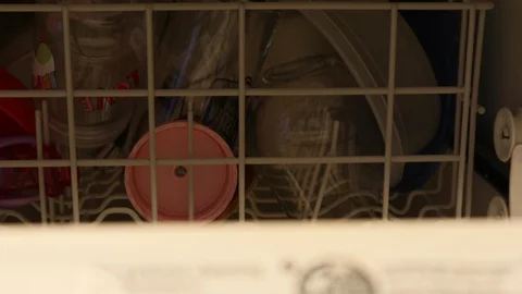 Closing Dishwasher Front Door to Start Cleaning Dishes Video stock 127260694