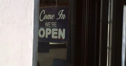 Closing the door and changing shop-sign Stock Footage 51635656