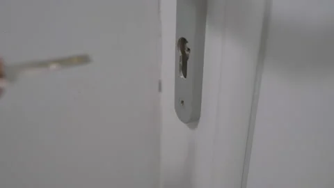 Closing the door with the key for protection Stock Footage 132456715