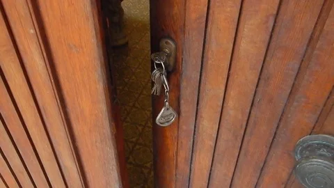 Closing the door using the key to operate the lock Stock Footage 105200923