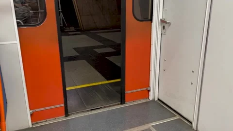 Closing the doors of the train in the subway. orange old vintage doors Stock Footage 249208386